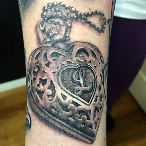 Advertisement Tattoos can ask a lot of the reader. . Simple heart locket tattoo